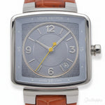 Louis Vuitton watch with brown leather strap and silver case on a white background