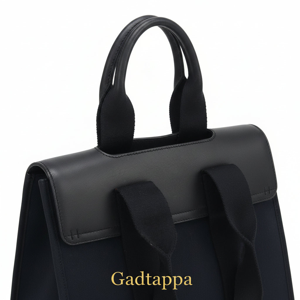 Close-up of a black bag with straps on a white background