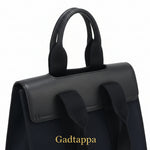 Close-up of a black bag with straps on a white background