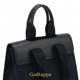 Close-up of a black bag with straps on a white background
